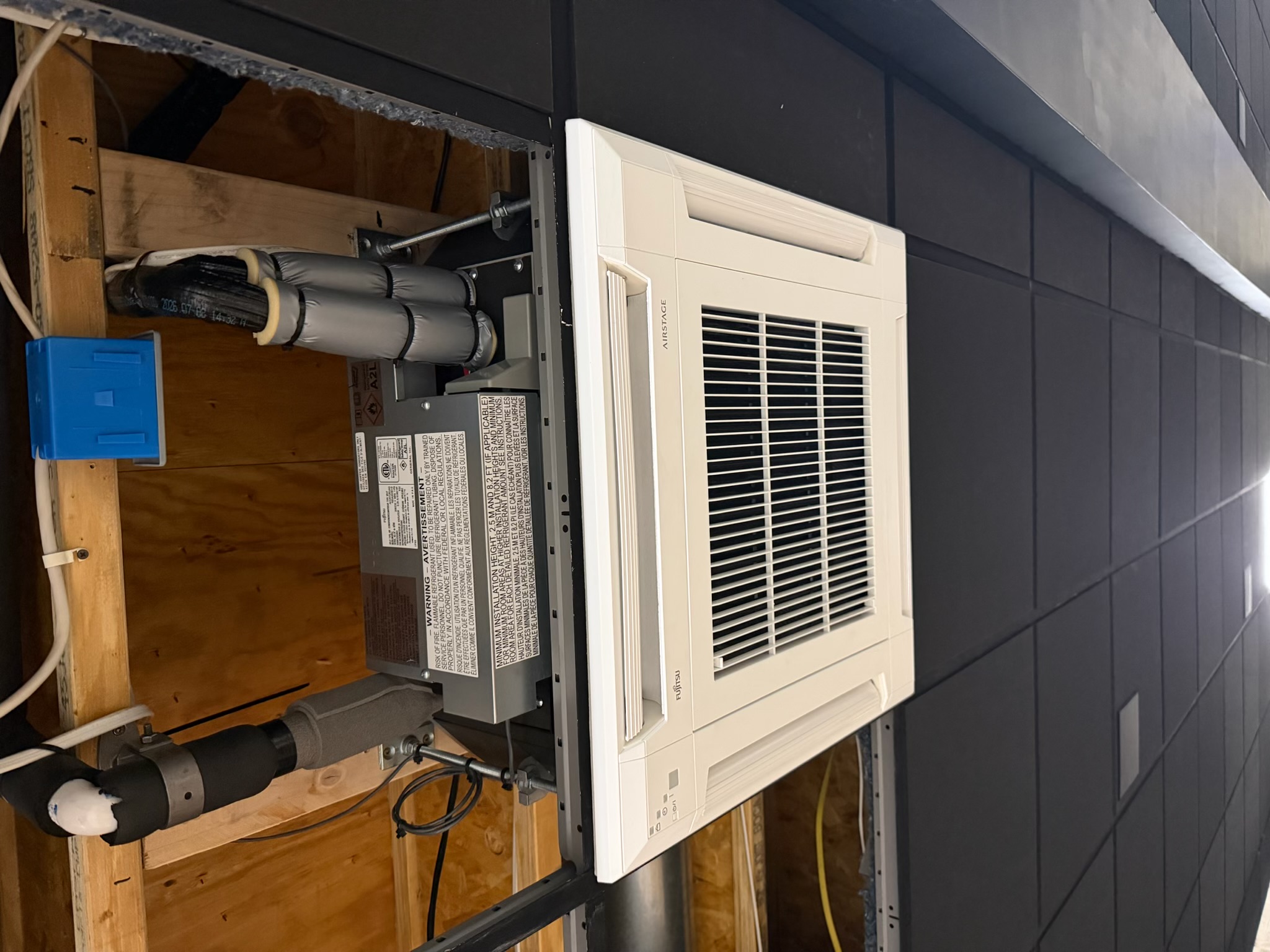 Ceiling-mounted Fujitsu mini-split cassette during installation in a West Chester Pennsylvania home theater